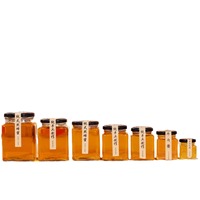 Vente en gros d'emballage de pots de miel pot de conserve carré bouteille vide mini pots de confiture de miel en verre carré avec couvercles noirs