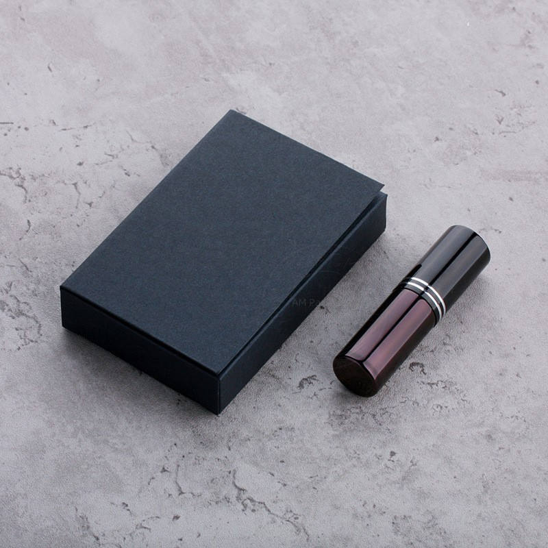 Black perfume spray bottle with black box