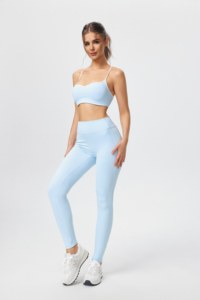 Sports bra and yoga pants set featuring a crisscross back; the pants lift the glutes and flatter the figure. - Product Image 2