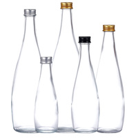 Eau gazeuse San Pellegrino Evian Aqua Carpatica 750ml en bouteille cylindrique en verre avec gravure et surface transparente, provenant du Jiangsu