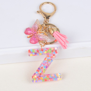 Venta al por mayor nueva moda colorida lentejuelas mariposa borla regalos para niñas mujeres Rosa acrílico 26 letras iniciales en inglés llaveros - Product Image 5