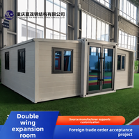 Conteneur de maison préfabriquée pliable à double aile de 20 pieds, espace de vie mobile et détachable, grande surface extensible de haute qualité