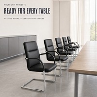 Chaise de bureau exécutive moderne en cuir avec accoudoirs fixes et base métallique pour conférence et bureau à domicile