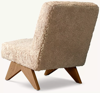 Fauteuil lounge sans accoudoirs en chêne massif, style simplicité moderne, avec cadre artisanal, rembourrage sur mesure, dossier incliné et pieds coniques en V inversé