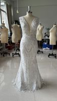 Robe de Mariée de Luxe Perle Longueur Ras du Sol Décolleté en V Profond Sans Manches Jupe Détachable Silhouette Sirène Moderne