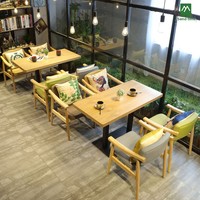 Ensemble table et chaises en bois massif de style nordique occidental pour restaurants commerciaux, idéal pour les cafés, salons de thé et bars à boissons