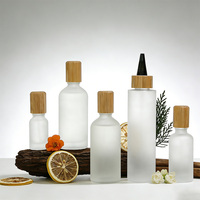 Bouteilles compressibles en verre dépoli personnalisées en gros avec bouchon en bambou, pots vides anti-fuite pour huile capillaire, sérum pour le cuir chevelu et produits de soin de la peau