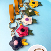 Mignon pendentif fleur en cuir PU en trois dimensions porte-clés élégant