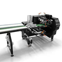 Machine d'emballage automatique industrielle multifonctionnelle de type coussin SZ-450 pour sachets plastiques, idéale pour l'emballage de produits alimentaires, snacks, bonbons et nougats.