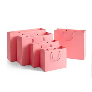 批发定制印刷Logo精品包装袋购物粉色牛皮纸袋带Logo
