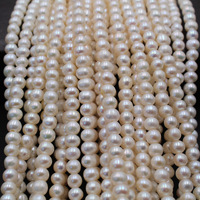 Perle d'eau douce naturelle presque ronde de haute qualité de 7 à 8mm avec un trou de grande taille de 2mm