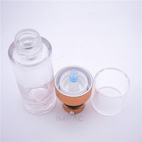 Flacon de lotion pour le visage en plastique rigide transparent rond et épais de 30 ml avec pompe dorée