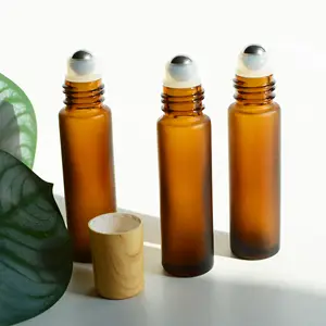 10ml Bouteille à rouleaux en verre ambré givré Bouteilles à billes en métal Impression en bois Bouteilles ambrées avec boule à billes en acier inoxydable