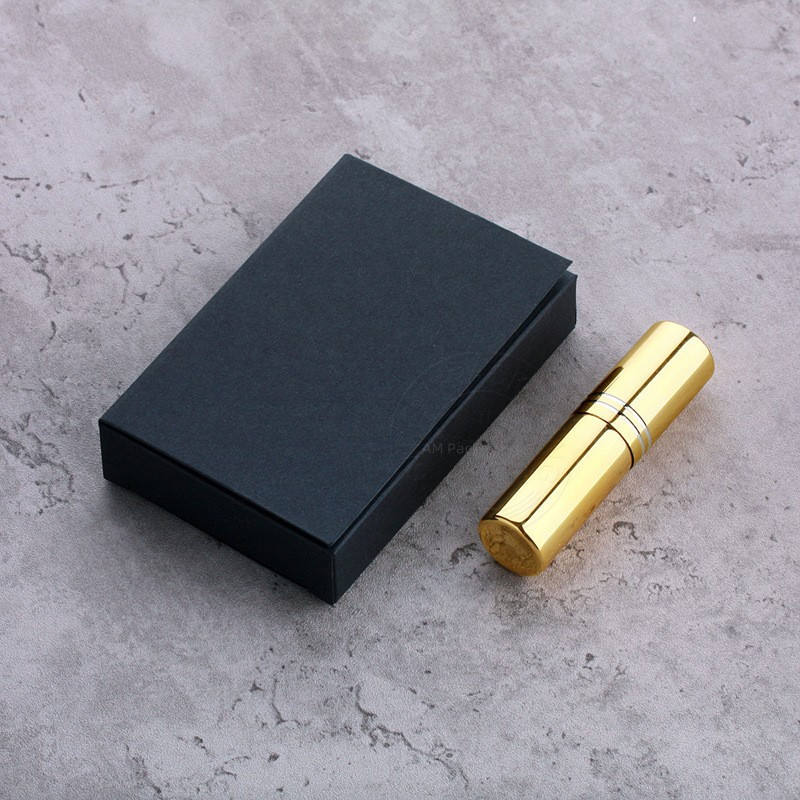 Gold perfume spray bottle with black box