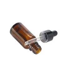 Vente en gros de flacons en verre cosmétiques et d'huiles essentielles de luxe JINHUA de 50 ml, couleur ambre, avec compte-gouttes, estampage à chaud, forme ronde, Shandong, Chine