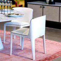 Chaise de salle à manger moderne de luxe rembourrée en cuir avec clous métalliques zippés pour mobilier de maison