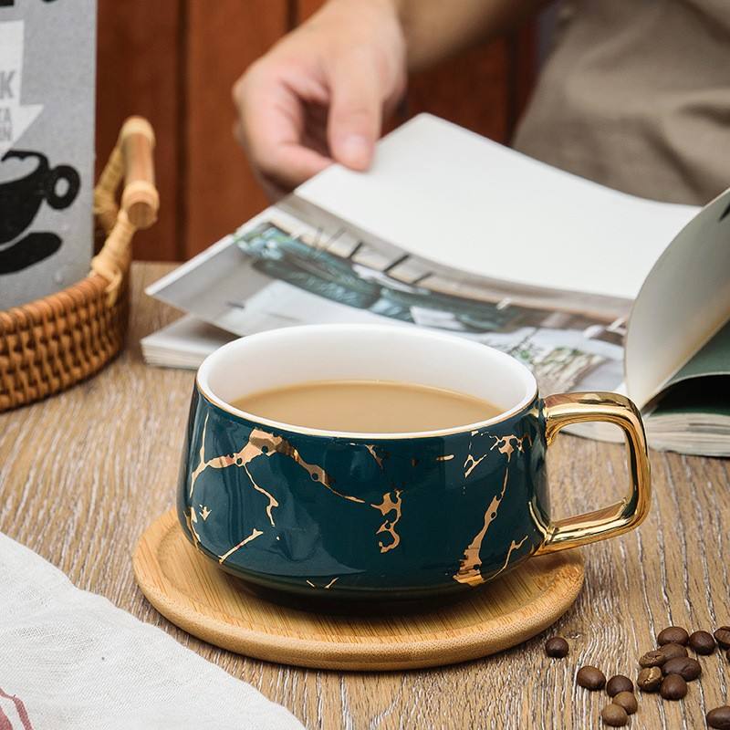 Green coffee cup with wood holder