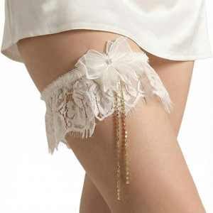 <span class=keywords><strong>Jarretière</strong></span> de <span class=keywords><strong>mariage</strong></span> de luxe en dentelle <span class=keywords><strong>ivoire</strong></span> avec chaîne de strass, pompon, nœud perlé, anneau de jambe de mariée pour la fête nuptiale - Product Image 1