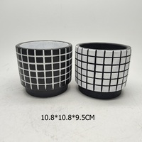 Elégant pot de fleurs irrégulier en ciment noir et blanc à motifs design classique simple pour jardin intérieur ou article décoratif pour la maison