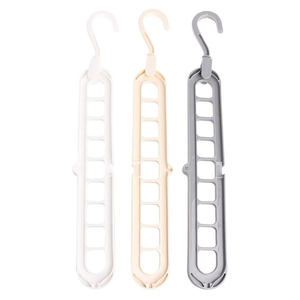 Estante de Almacenamiento Multifuncional de Plástico con Nueve Orificios, Percha Mágica Plegable para Ropa - Product Image 1