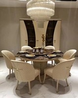 Table ronde en céramique à une seule jambe et chaises en cuir pour salle à manger