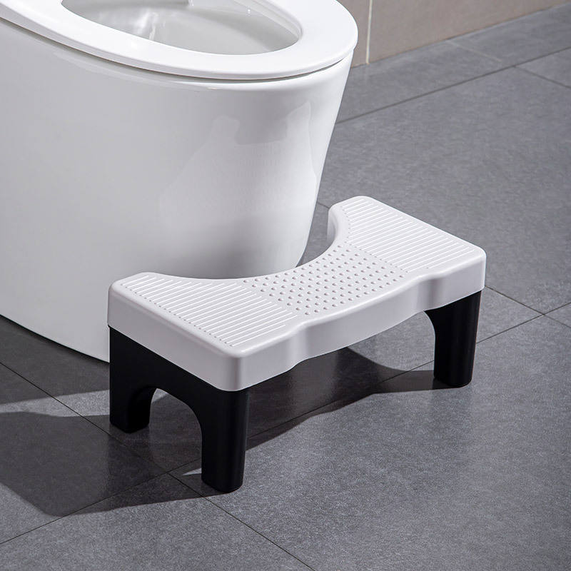 Stool with gray surface and black legs