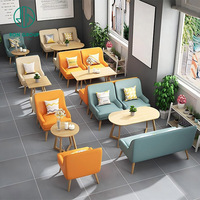 Ensemble de meubles de salle à manger pour café, restaurant, style moderne, canapés en cuir bleu, vert, beige, orange, tables basses ovales en bois clair