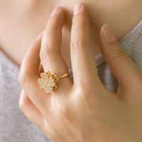 Bague géométrique rotative à feuilles de fleurs, version coréenne, très tendance, design de niche féminin, plaqué or haut de gamme, cuivre, pierre naturelle
