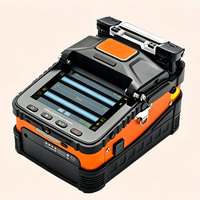 AI-5 Pro & AI-6C Fiber Fusion Splicer, 6 Motor Penyelarasan Inti, Penyambungan 8 detik Pemanasan 18 detik untuk FTTH & Pemantauan Keamanan