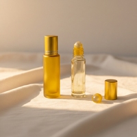 Vente en gros de 5ml 10ml de rouleau en verre transparent pour soins de la peau sérum rouleau en acier pour boule couvercle en or pour huile essentielle