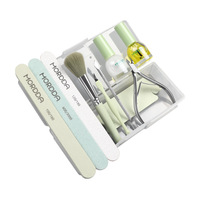 Kit complet d'outils de soin des ongles en plastique, comprenant des ciseaux à cuticules, un repousse-cuticules en acier, une éponge de polissage et une bande abrasive