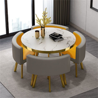 Ensemble de table à manger ronde moderne, luxueuse, durable, imperméable et écologique avec chaises en métal pour une utilisation en extérieur dans les hôtels, 1 table et 4 chaises