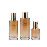Nouveau Style luxueux ovale fond épais cristal bouteille cosmétique en verre personnalisé couvercle ambre translucide peut être personnalisé or mat