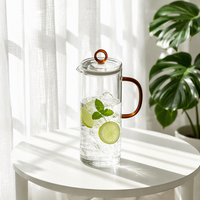 Nouvelle Tendance : Ensemble de service à eau et thé en verre contemporain de 1300 ml avec poignée, couvercle et bec verseur, écologique et résistant à la chaleur, pour eau froide et chaude, thé et cuisine