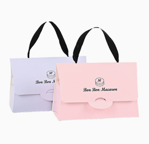 Handheld macaron gift <b>box</b> made of thickened <b>white</b> cardboard with fabric ribbon handles formed by color printing die cutting - Product Image 1