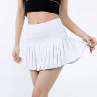 Mini robe de tennis d'été à la mode pour femmes Sportswear Jupes plissées sexy personnalisées en gros en vêtements de tennis pour filles en noir et blanc