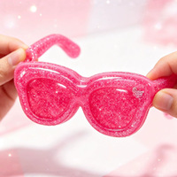 Nouveauté 2026, Jouet à presser anti-stress souple à rebond lent, design tendance et cool, en forme de lunettes rose pailleté Vaseline, pour le marché international