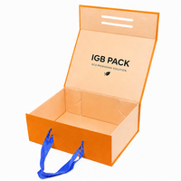 Boîte à chaussures pliable en papier recyclé écologique orange mat avec fermeture magnétique et poignée en ruban
