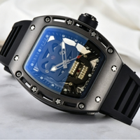 Montre mécanique automatique à cadran crâne creux, boîtier tonneau, bracelet en caoutchouc, montre-bracelet de luxe sport pour homme