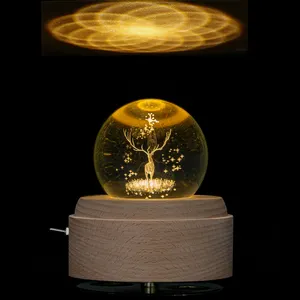 Scatole musicali trasparenti della sfera di cristallo del regalo creativo del carillon di legno di trasporto di goccia
