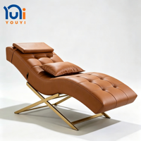 Chaise longue de massage ergonomique de luxe, base en métal, revêtement en cuir PU, lit de beauté inclinable pour salon, salle de traitement clinique