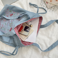 Sac à cordon en jean brodé grande capacité, tendance, à porter à l'épaule ou à la main, idéal pour l'école et le Nouvel An