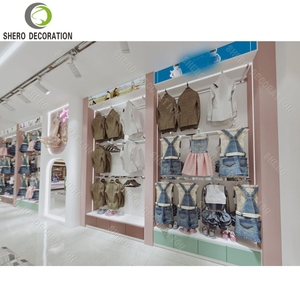 Kids Clothing Shop Design Custom Wall Mounted Metal Clothing Store Display Rack Clothing Store Furniture For Baby Shop Design - Product Image 1