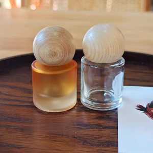 Bouteille en verre vide pour huiles essentielles, 15 ml, 30 ml, avec bouchon rond en bois, nouveau design, logo personnalisé, orange transparente, vente chaude - Product Image 1