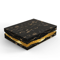 Nouvelle table basse de luxe en marbre noir avec veines dorées pour une décoration intérieure élégante