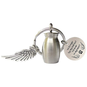 Nuevo Diseño de Regalo Conmemorativo para Mascotas, Llavero de Acero Inoxidable con Forma de Ala de Ángel para Cenizas |   Porta Recuerdos Grabado para Perros y Gatos - Product Image 1