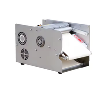 Machine électrique automatique de petite taille pour la maison - idéale pour la fabrication de croissants dans les boulangeries. Il est utilisé pour façonner la pâte et le lait.
