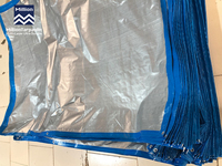 Bâche en PE ignifuge MILLION 150 g/m² bleue argentée, pliable, imperméable avec œillets métalliques pour protection extérieure