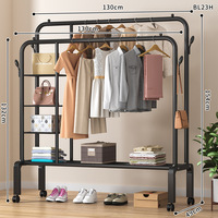 Porte-manteau double sur pied avec double rangée de cintres pour usage intérieur, étagère à linge mobile