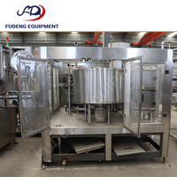 Machine de remplissage automatique polyvalente pour différentes tailles de bouteilles, remplisseuse linéaire par gravité avec réglage facile du volume